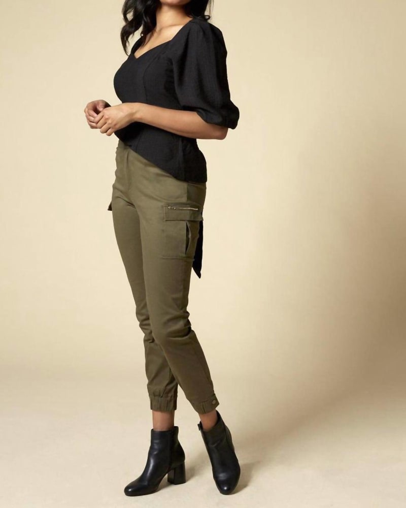 Front of a model wearing a size L (8-10) High-Waist Cargo Pant In Olive in Olive by Hope Horizon. | dia_product_style_image_id:360346